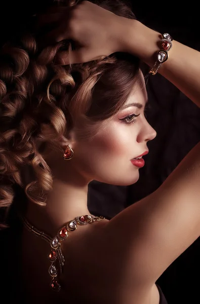 Young woman with makeup and with jewelry