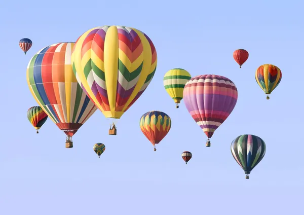 A group of colorful hot-air balloons floating