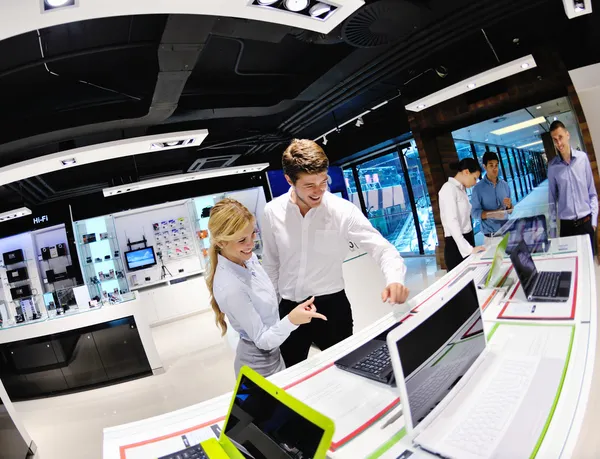 Young couple in consumer electronics store