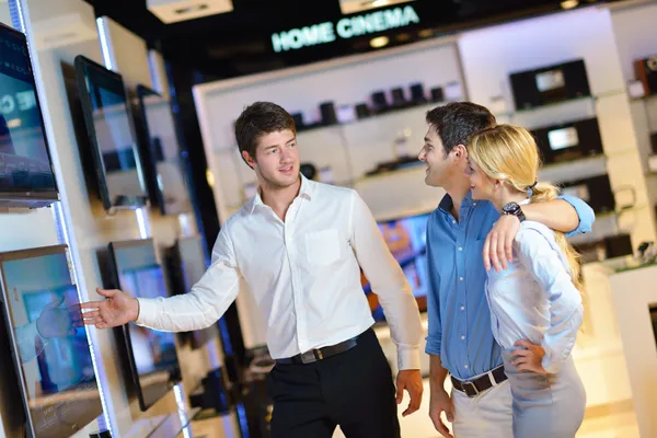 Young couple in consumer electronics store