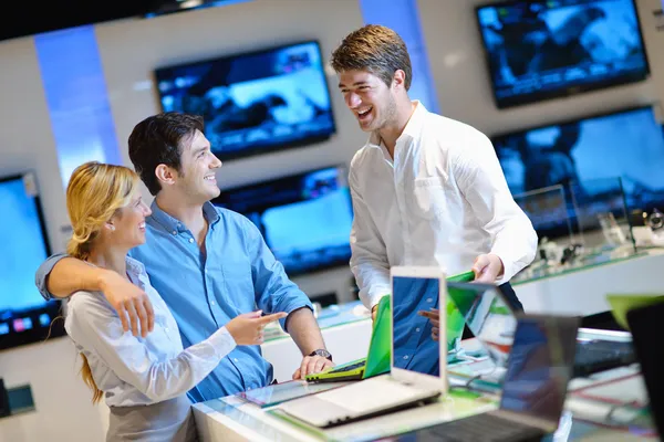 Young couple in consumer electronics store