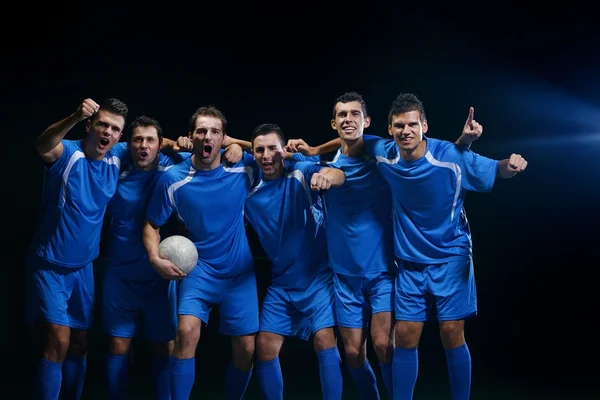 Soccer players celebrating victory