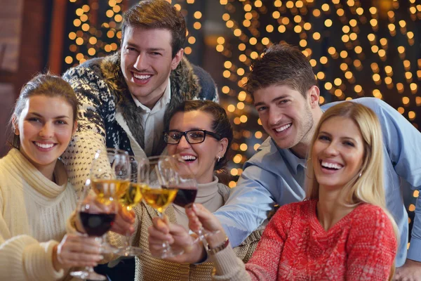 Group of happy young drink wine at party