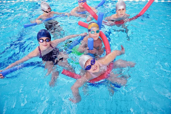 Happy children group at swimming pool