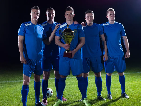 Soccer players celebrating victory