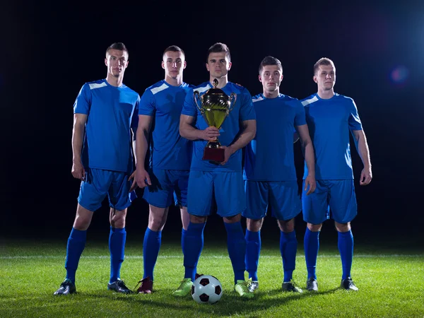 Soccer players celebrating victory