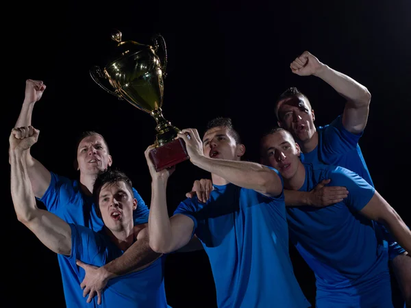 Soccer players celebrating victory