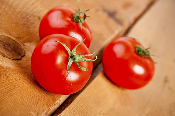 Tomatoes, cooked with herbs for the preservation on the old wood