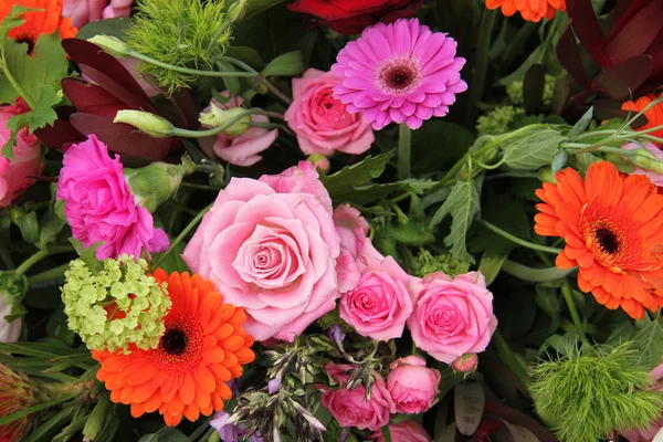 Flower arrangement in pink, red and orange