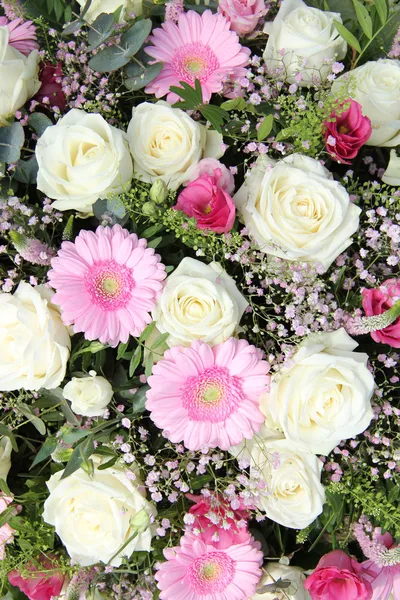 Pink gerberas and white roses in bridal arrangement