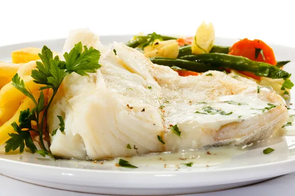 Fish dish - fish fillet, French fries and vegetables