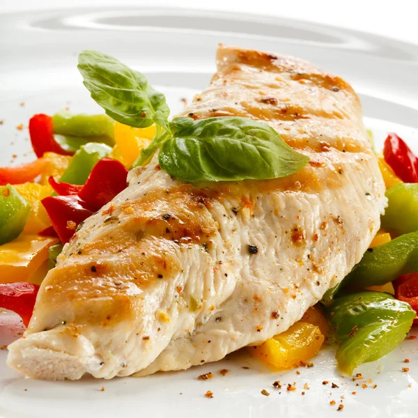 Grilled chicken breasts and vegetables