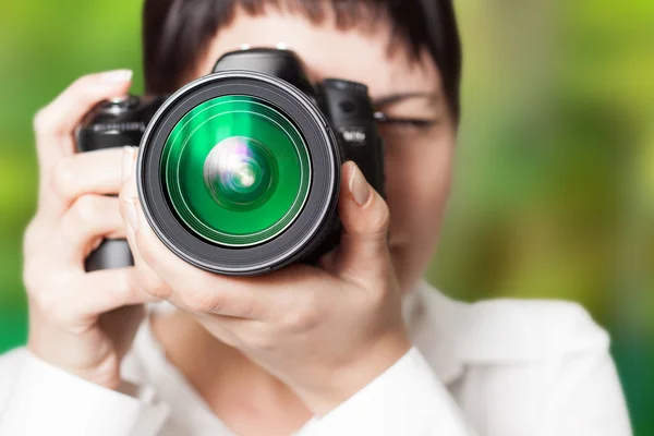 Woman photographer with camera