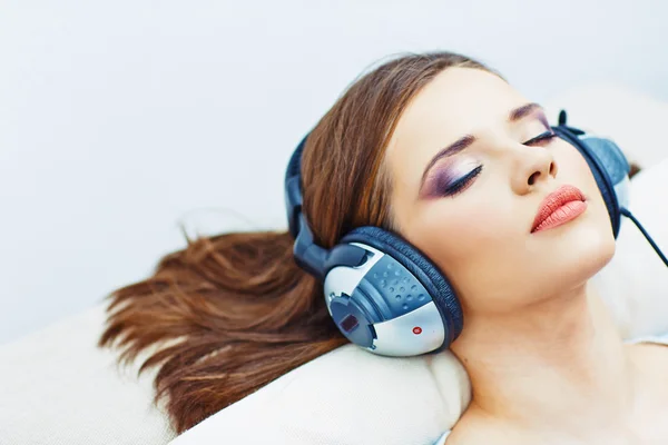 Sleeping girl with headphones.