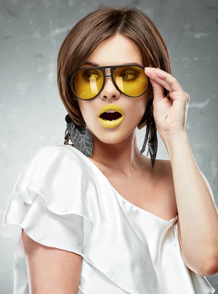 Woman with yellow lips and glasses