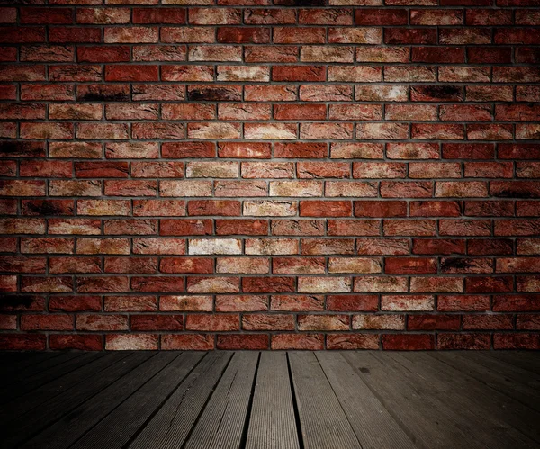 Brick wall and wooden planks