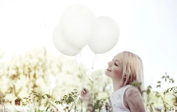 Woman with balloons