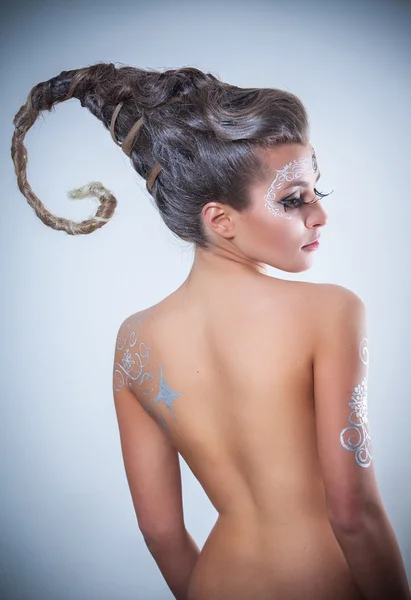 Nude girl with silver drawings