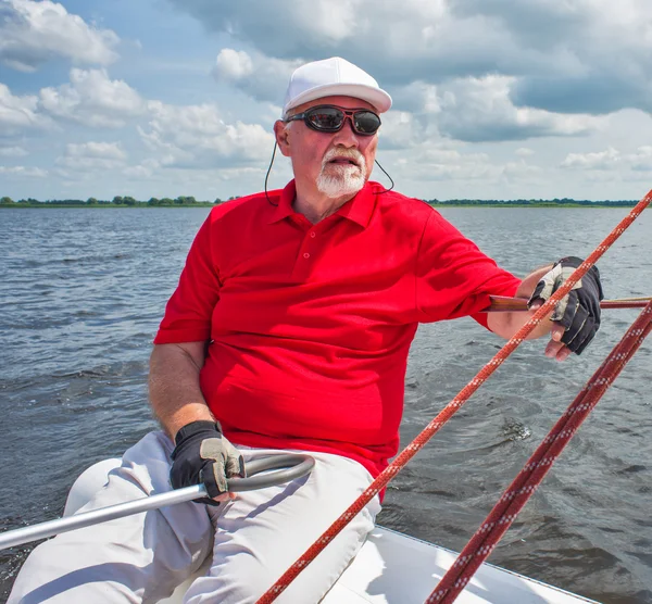 Senior man on sailing yacht