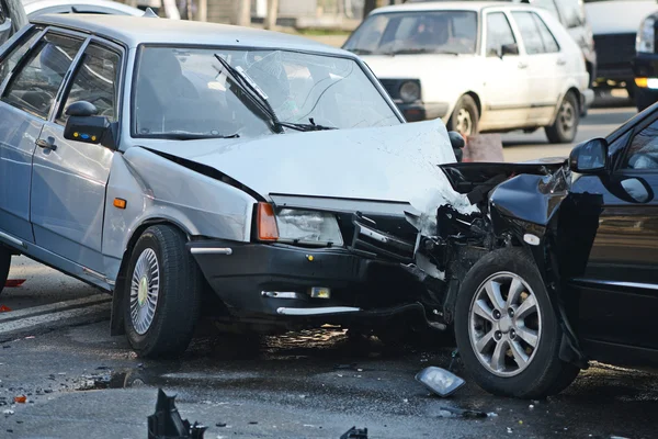 Auto accident involving two cars on a city street