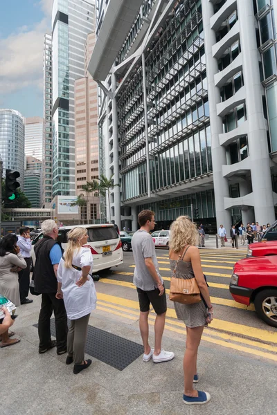 American tourists at a crosswalk in Hong Kong