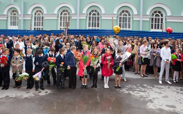 Children with flowers near the School on the first day of school on September 1, 2011 in Saint-Petersburg, Russia