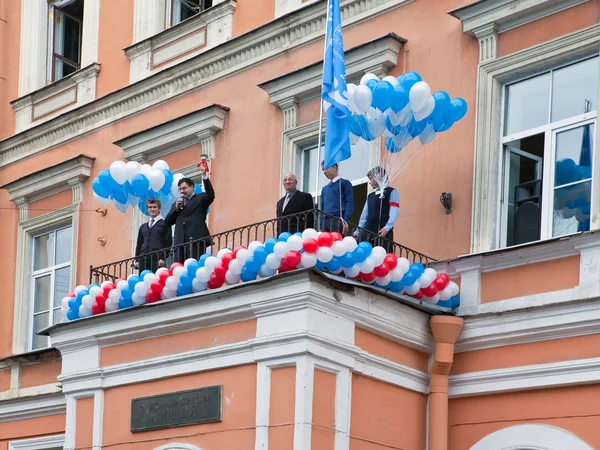 The director rings a hand bell, opening academic year on September 1, 2011 in Saint-Petersburg, Russia