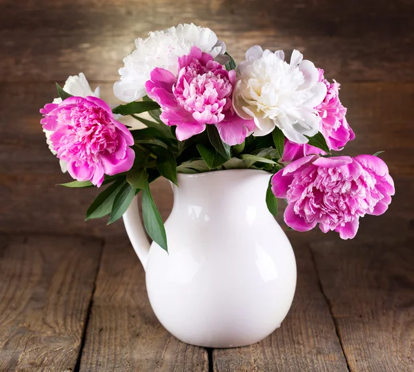 Still life with bunch of peonies