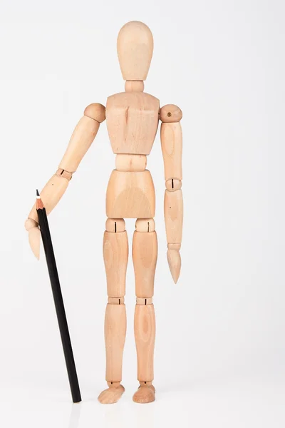 Small wood mannequin standing with colour pencil isolated on whi