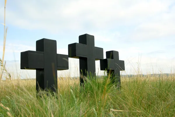 Three black crosses