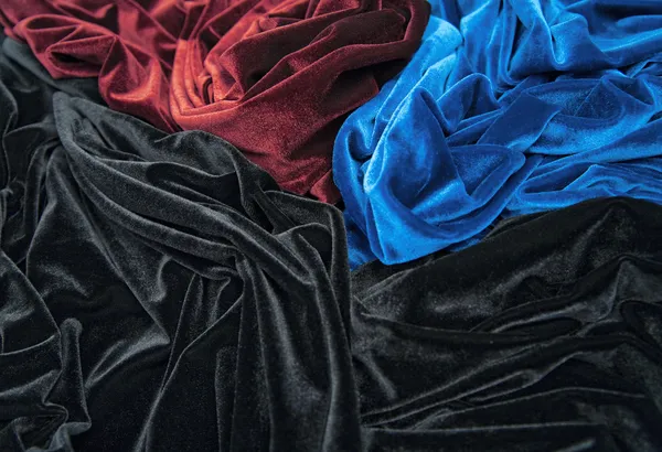 Blue red and black glossy velvet is formative folds and light-shadow picture