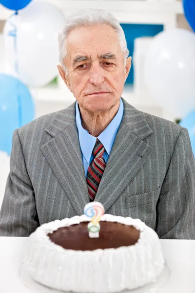Senior man with birthday cake