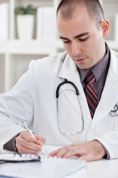 Writing a prescription or medical examination notes