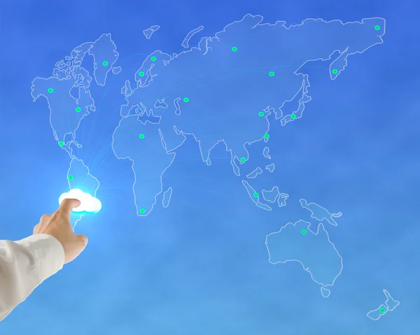 Businessman touching glowing cloud with worldwide map background