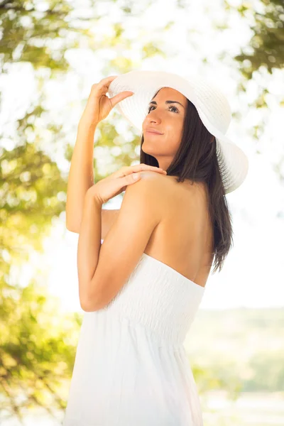 Beautiful woman with white sun hat