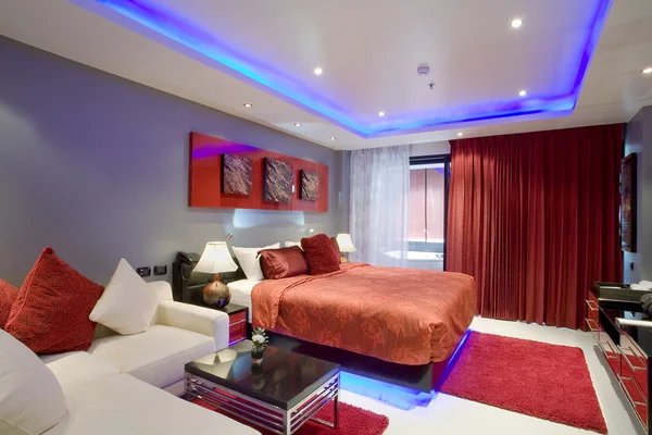 Panoramic view of nice stylish modern bedroom.