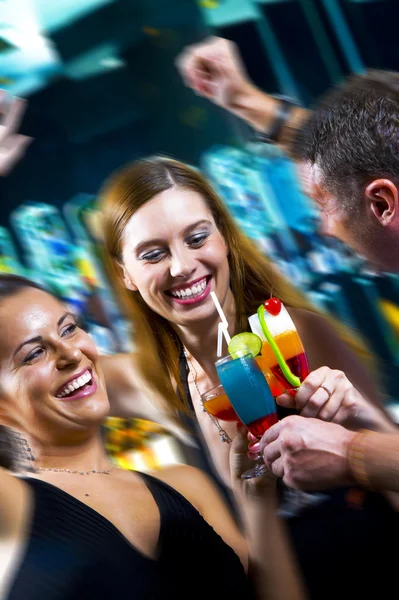 Motioned portrait of young attractive having fun in night club