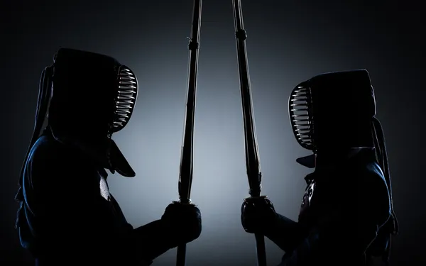 Two kendo fighters opposite each other