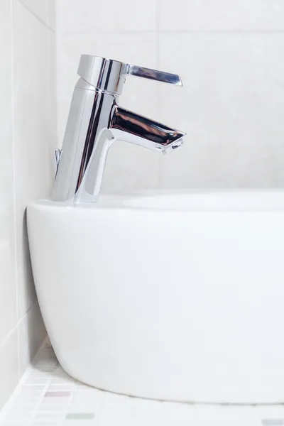 Side view of basin with mixer faucet