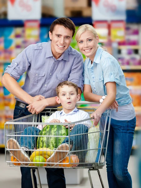 Family drives shopping trolley