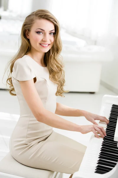 Portrait of pianist sitting and playing piano