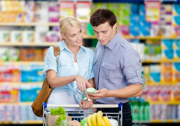 Couple discussing the shopping list
