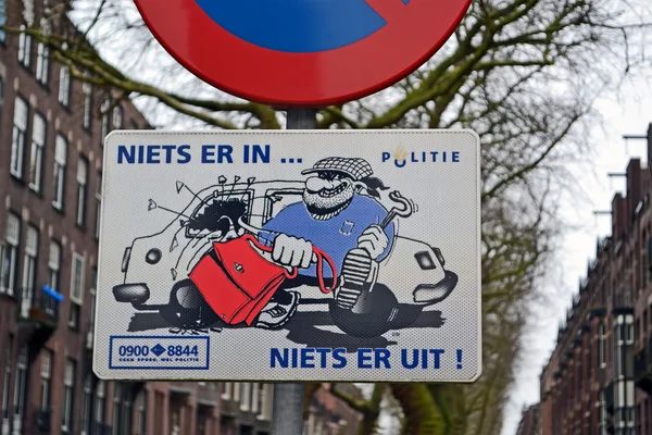 Attention! auto thief activity as road sign in Amsterdam, Netherlands.