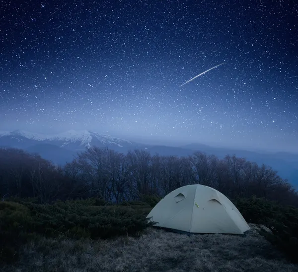 Camping at night in the mountains