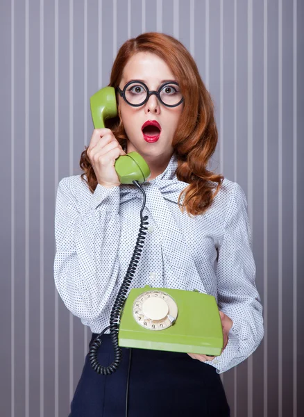 Women with green telephone