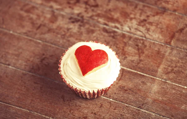 Cream cake with apple heart on it