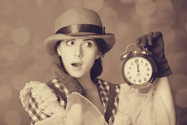 Beautiful women with clock.