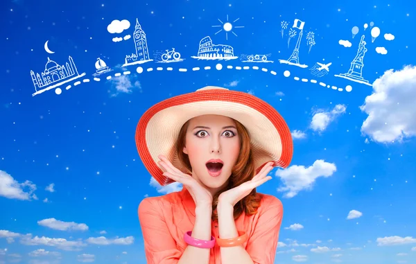 Surprised redhead women and travel map on background