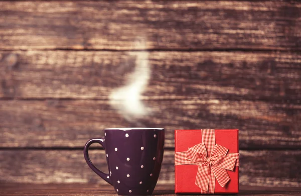 Gift box and cup of coffee