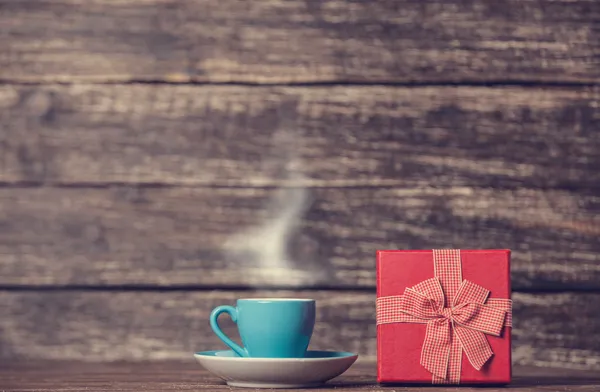 Gift box and cup of coffee